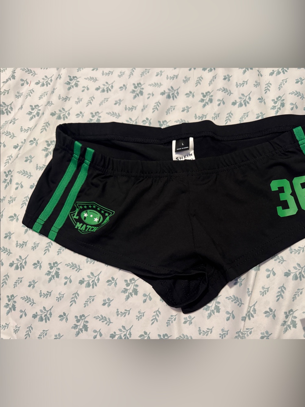 Match Black Women's Athletic Shorts with Green Accents